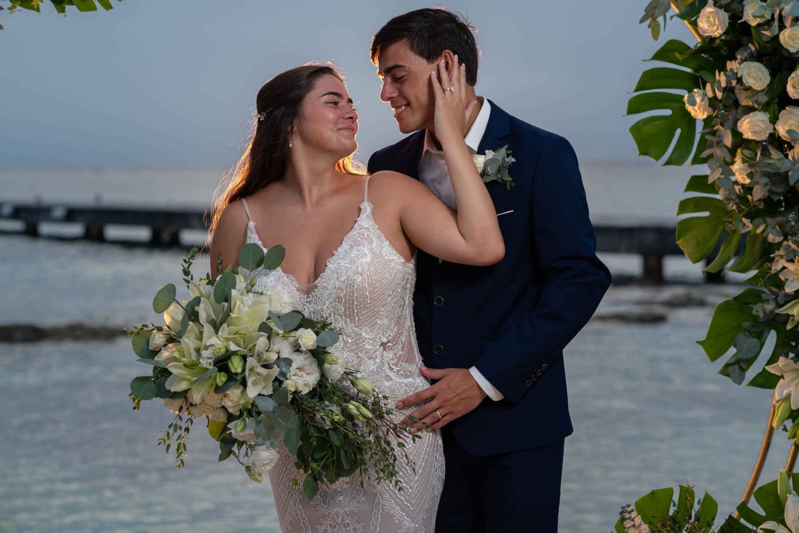 Destination wedding couple by the shoreline
